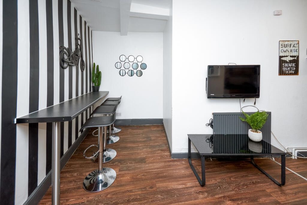 Property photo 3 of 4 This Vibrant Communal Lounge Features Stylish Bar ...