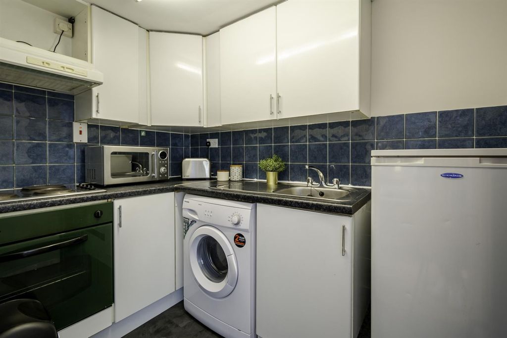 Property photo 3 of 4 Bright Kitchen With Modern Appliances And Storage...