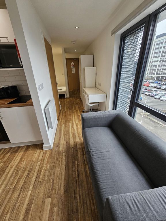 Property photo 2 of 17 Modern And Bright Living Room Featuring A Comforta...