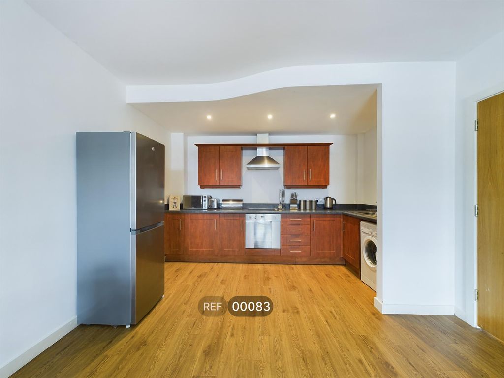 Property photo 3 of 7 Kitchen & Living Area