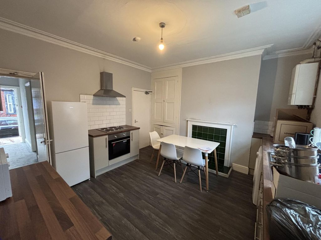 Property photo 1 of 10 A Bright And Modern Living Room Featuring A Cozy F...