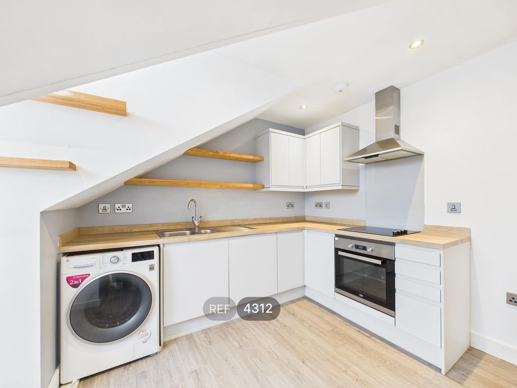 Property photo 2 of 9 Kitchen / Living Area