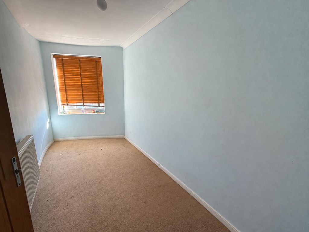 Property photo 3 of 7 Empty Blue Bedroom With Wooden Blinds.Png