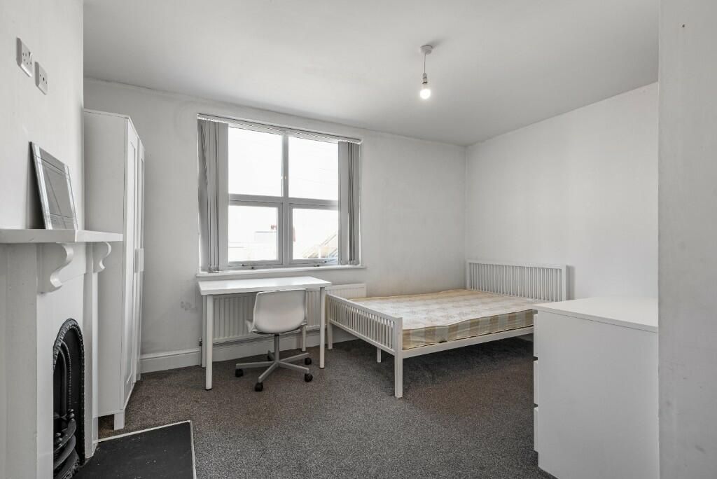 Property photo 1 of 14 A Bright And Tidy Master Bedroom Featuring A Comfo...