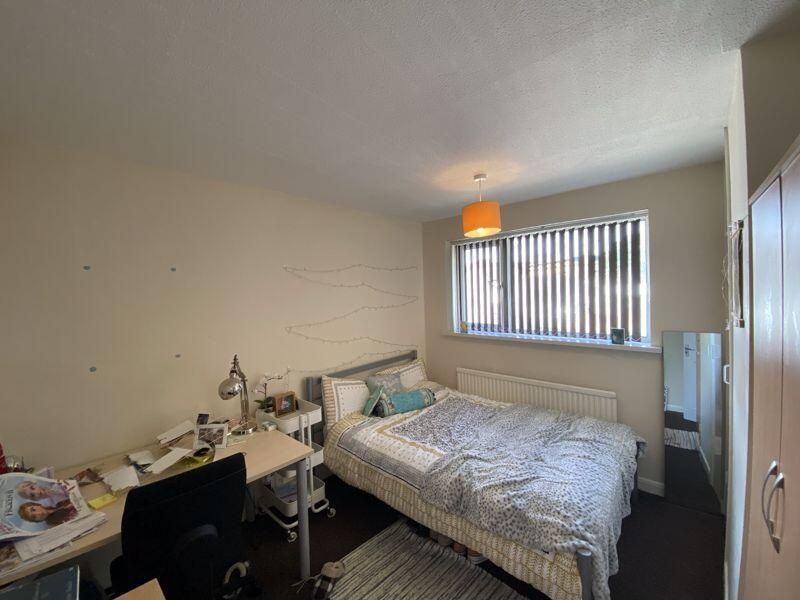 Property photo 2 of 8 A Spacious Master Bedroom Featuring A Large Bed Wi...