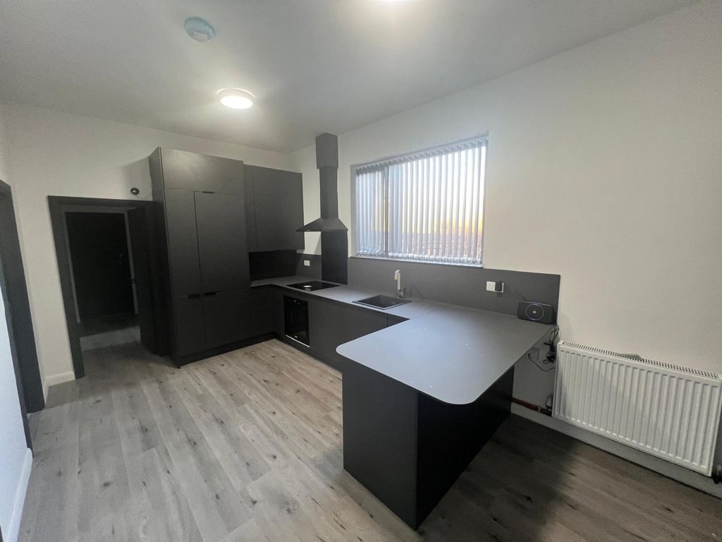 Property photo 1 of 8 Kitchen Area