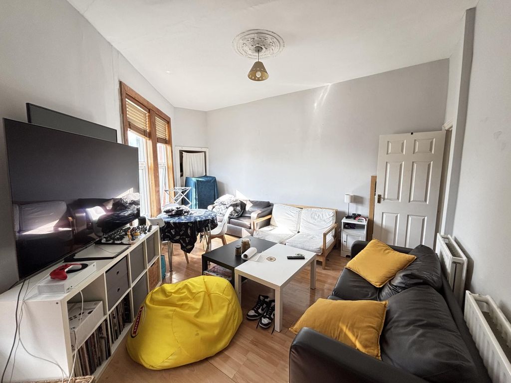 Property photo 2 of 21 A Spacious And Well-Lit Living Room Featuring Mode...