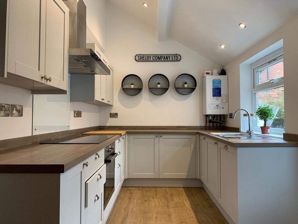 Property photo 2 of 8 Bright, Modern Galley Kitchen With White Cabinetry...