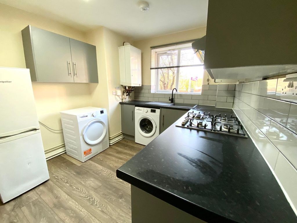 Property photo 2 of 8 Modern Galley Kitchen With Dark Worktops, Grey Cab...
