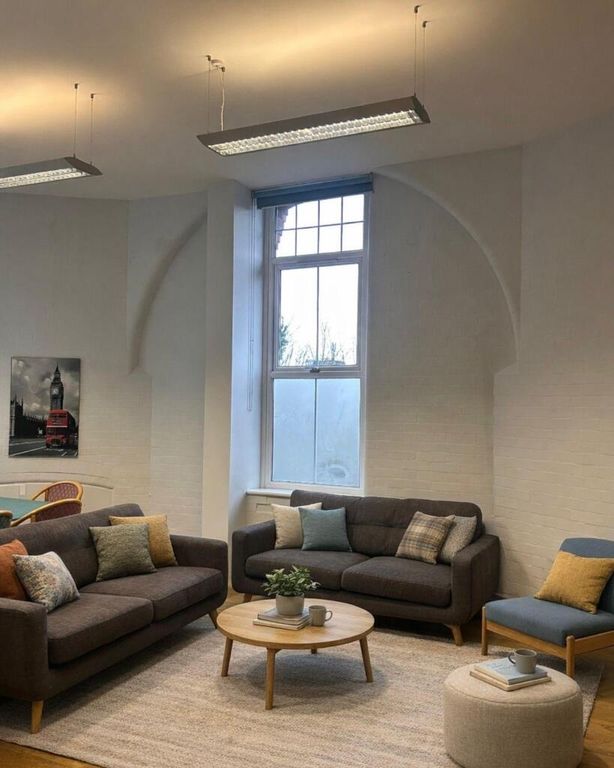 Property photo 1 of 10 Elegant Lounge With High Ceilings And Comfy Sofas...