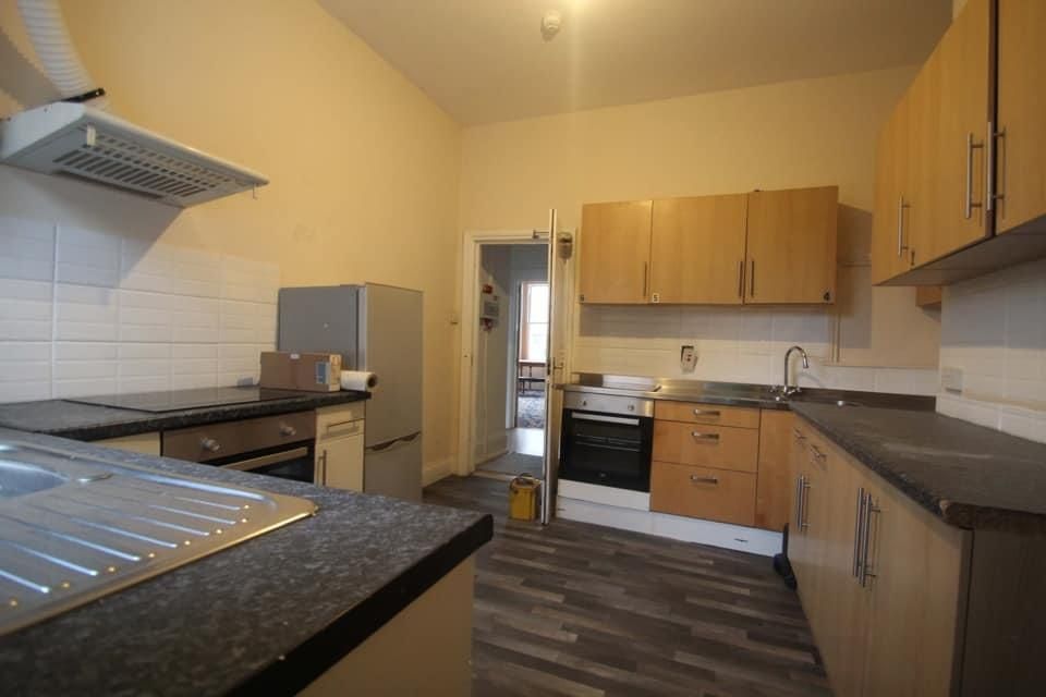 Property photo 2 of 3 Bright Kitchen With Ample Storage And Workspace...