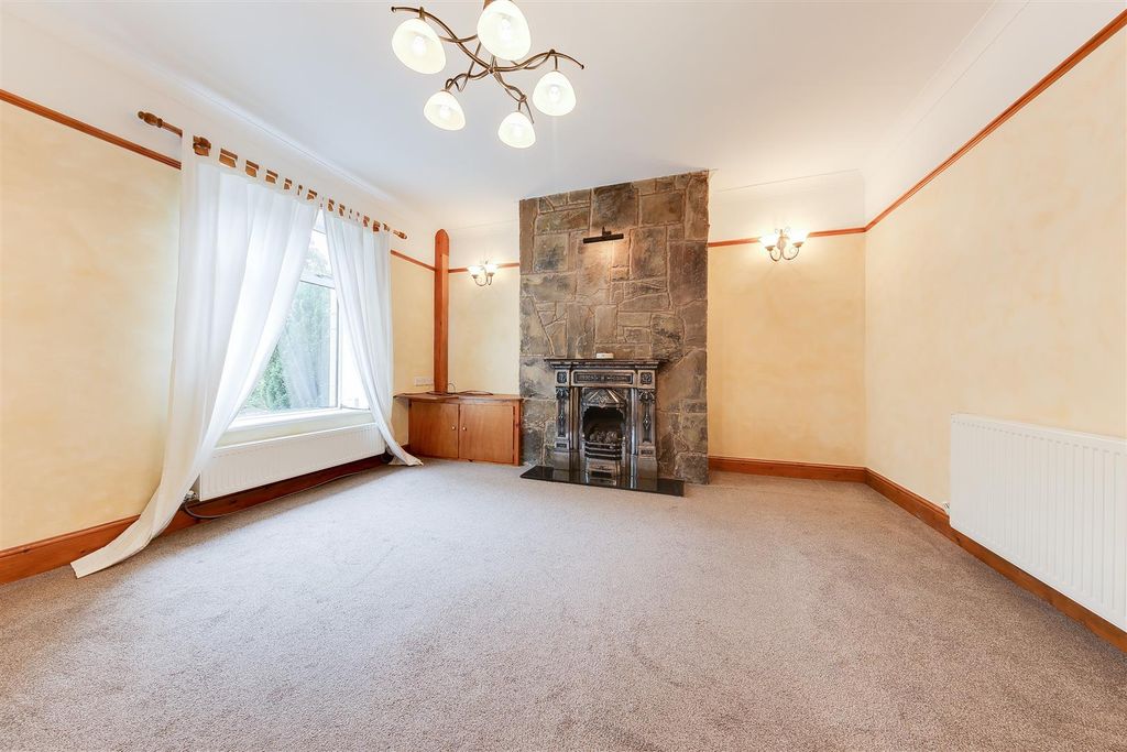Property photo 3 of 12 Lounge &amp; Fireplace