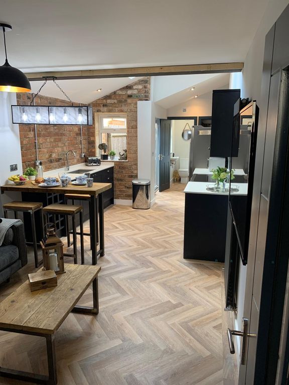 Property photo 2 of 6 Modern And Stylish Kitchen Featuring Sleek Black c...