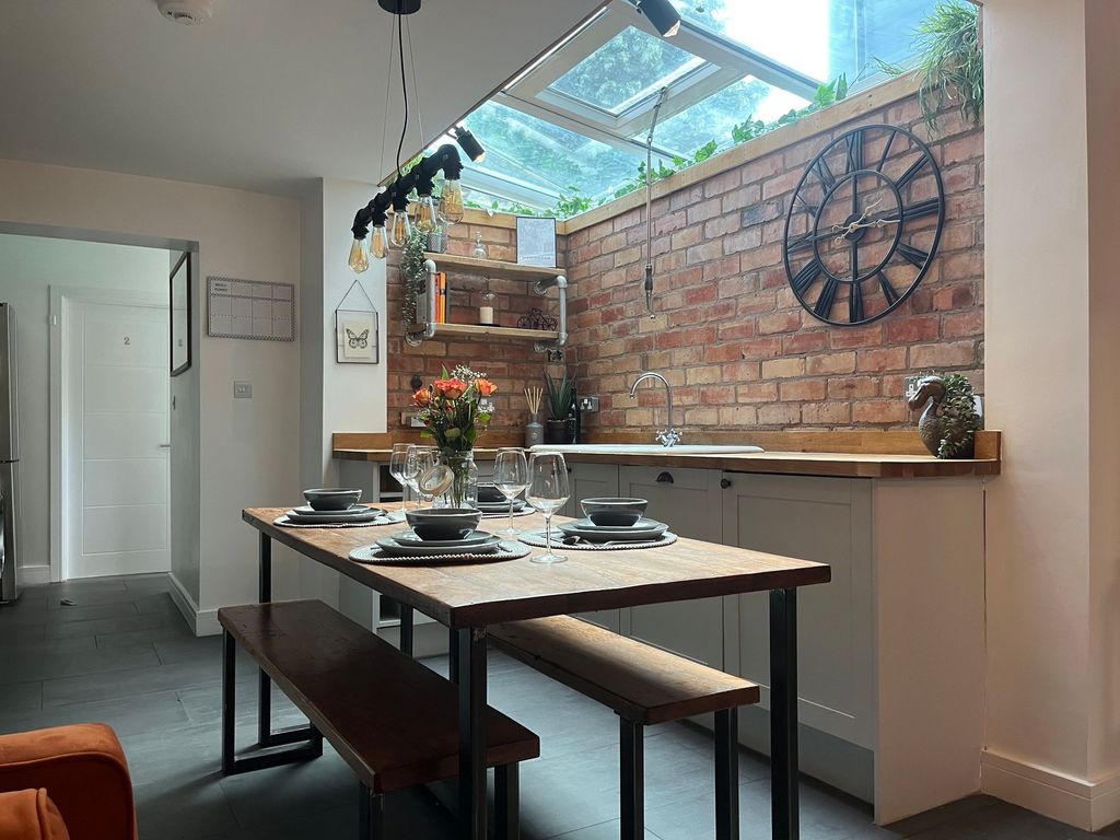 Property photo 3 of 7 Modern Kitchen Featuring A Wooden Dining Table Set...
