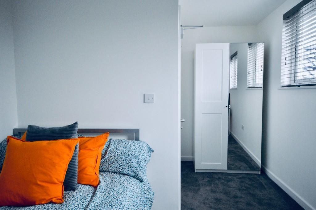 Property photo 3 of 12 A Bright And Inviting Bedroom With A Neatly Made B...