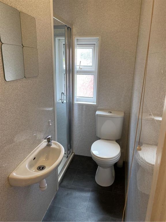 Property photo 3 of 12 A Clean And Well-Maintained Bathroom Featuring A S...