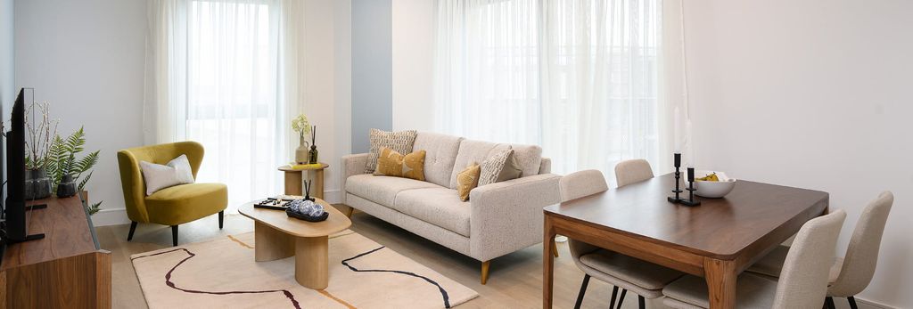 Property photo 1 of 5 Living Space With Sofa And Coffee Table, Rug, Square Dining Table