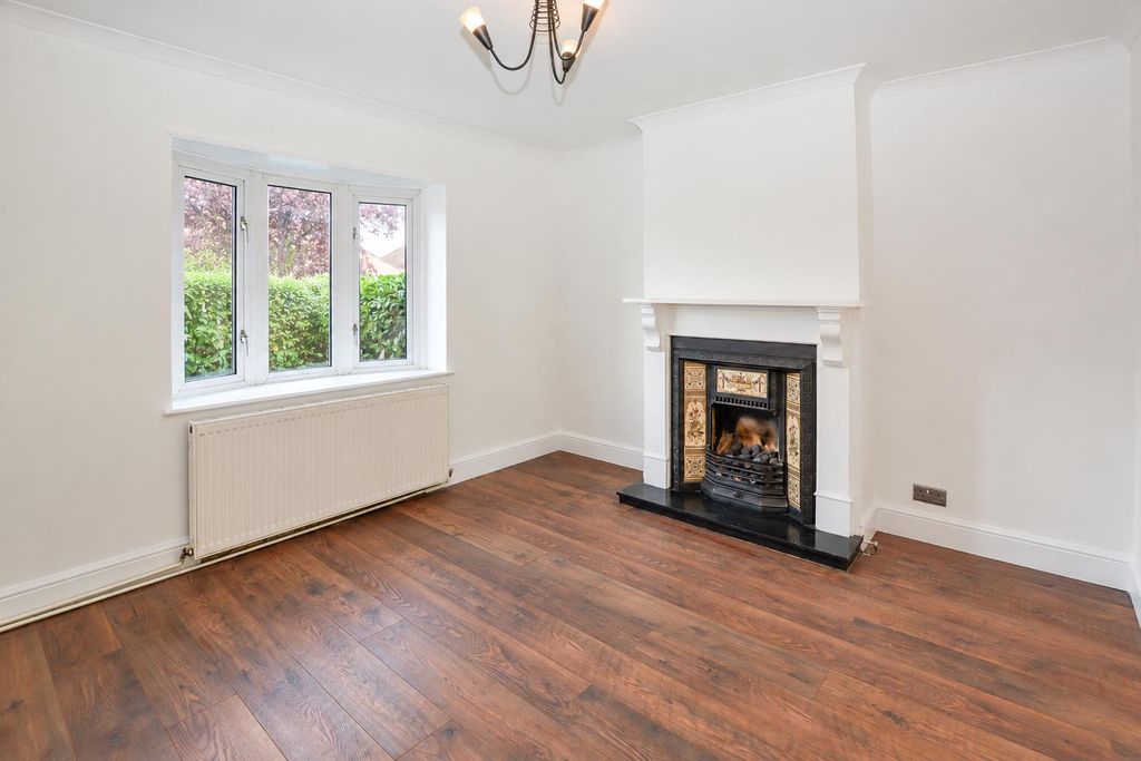 Property photo 2 of 16 Bright Empty Living Room With Fireplace.Png