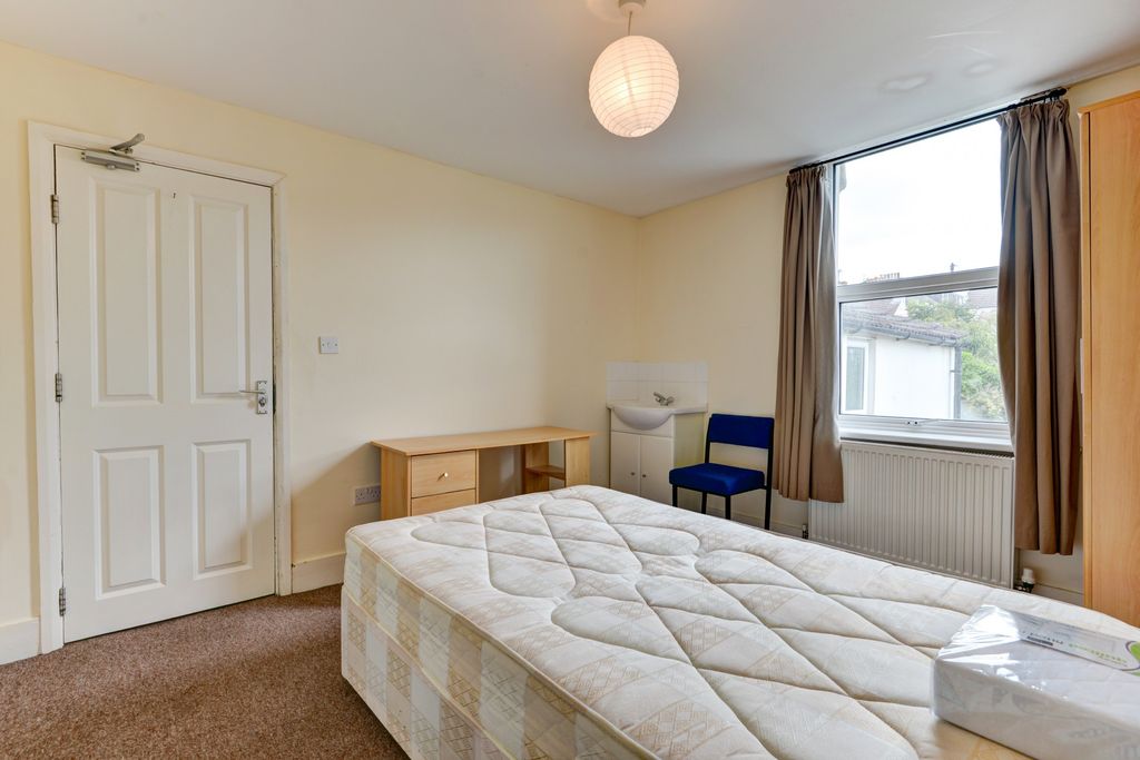 Property photo 1 of 11 A Well-Lit, Tidy Bedroom Featuring A Comfortable d...