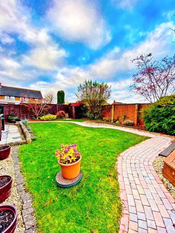 Property photo 3 of 10 A Beautifully Landscaped Garden Featuring A Vibran...