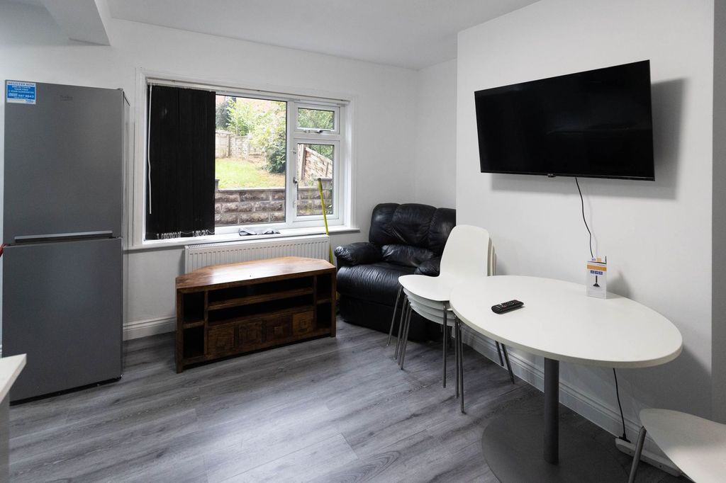 Property photo 3 of 9 A Bright, Welcoming Living Room Featuring A Large ...