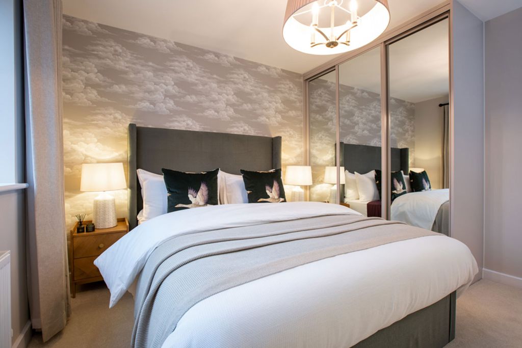 Property photo 3 of 7 A Cozy And Inviting Bedroom With A Large Bed, Mirrored Closet Doors