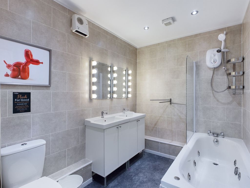 Property photo 2 of 7 A Spacious And Modern Bathroom Featuring A Relaxin...