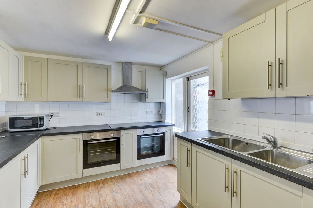 Property photo 2 of 25 Bright And Clean Kitchen Featuring Modern Applianc...