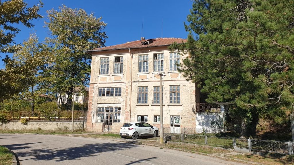 Property photo 1 of 88 Front View Of The Three-Level Former School Building Showing Weathered Facade And Surrounding Trees