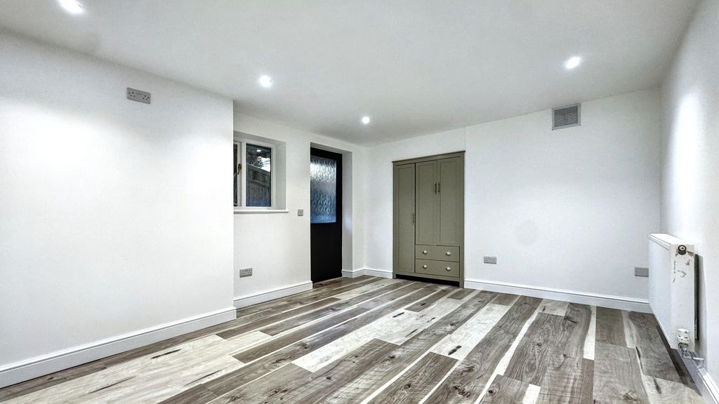 Property photo 3 of 7 Bright, Modern Living Space With Fresh White Walls...