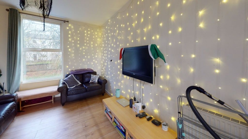 Property photo 2 of 14 A Cozy Living Room Featuring A Comfortable Armchai...