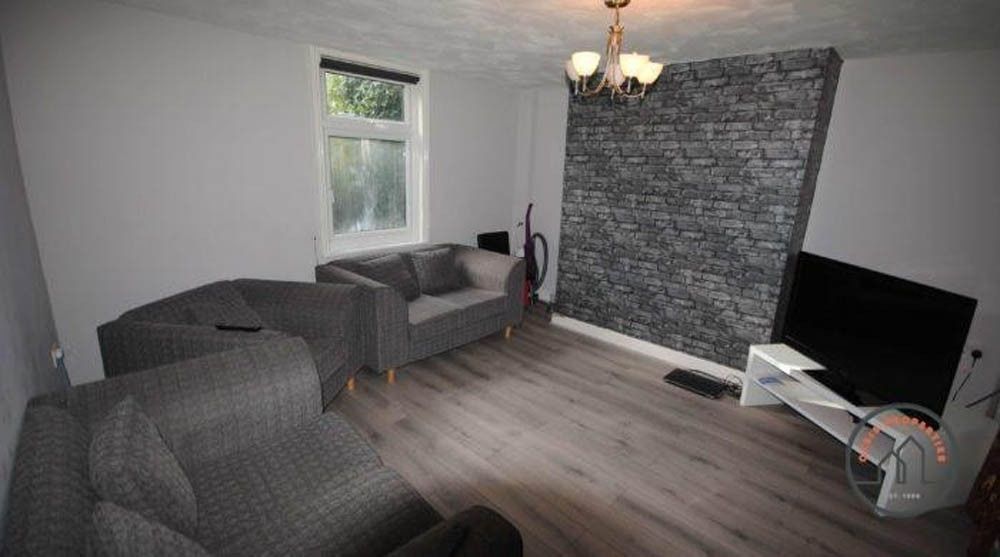 Property photo 1 of 6 A Cozy Living Room Featuring Modern Grey Sofas, A ...