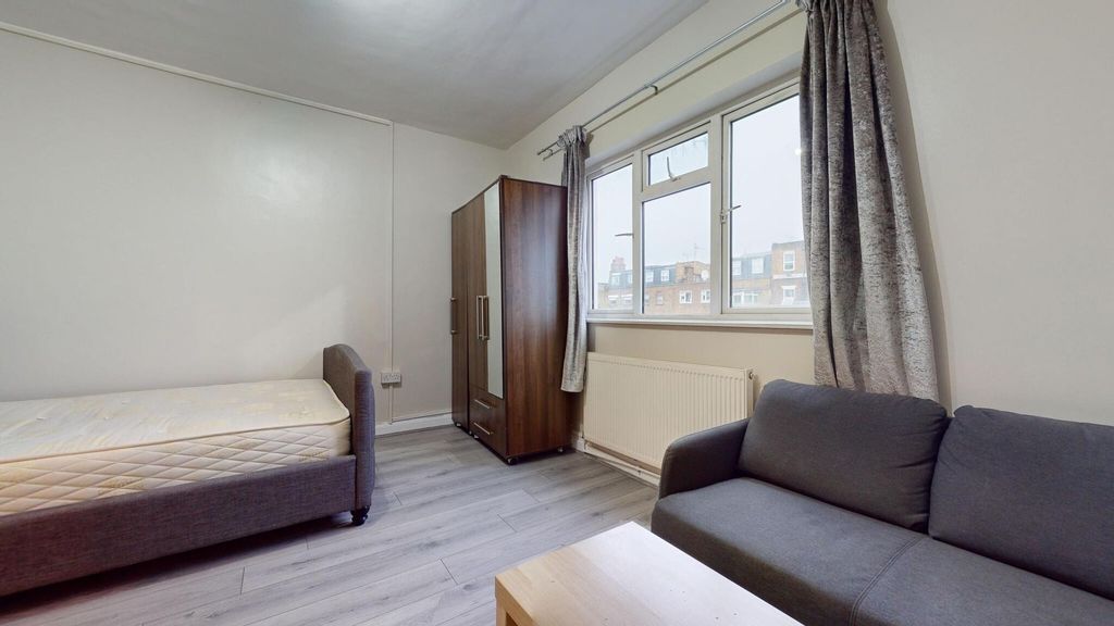 Property photo 3 of 6 A Neat Single Bedroom Featuring A Comfortable Bed,...