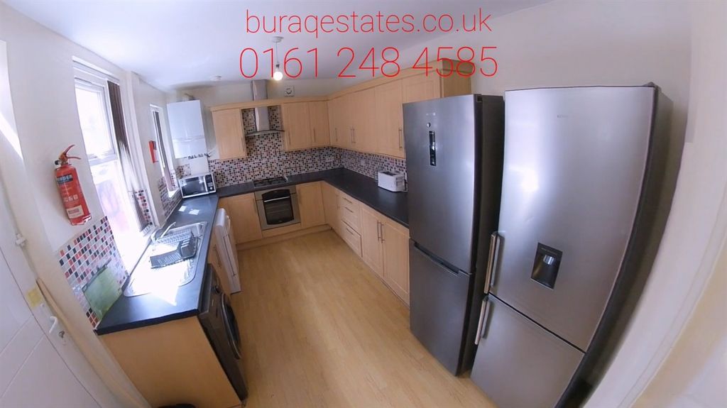 Property photo 3 of 12 Bright Modern Galley Kitchen With Light Wood Cabin...