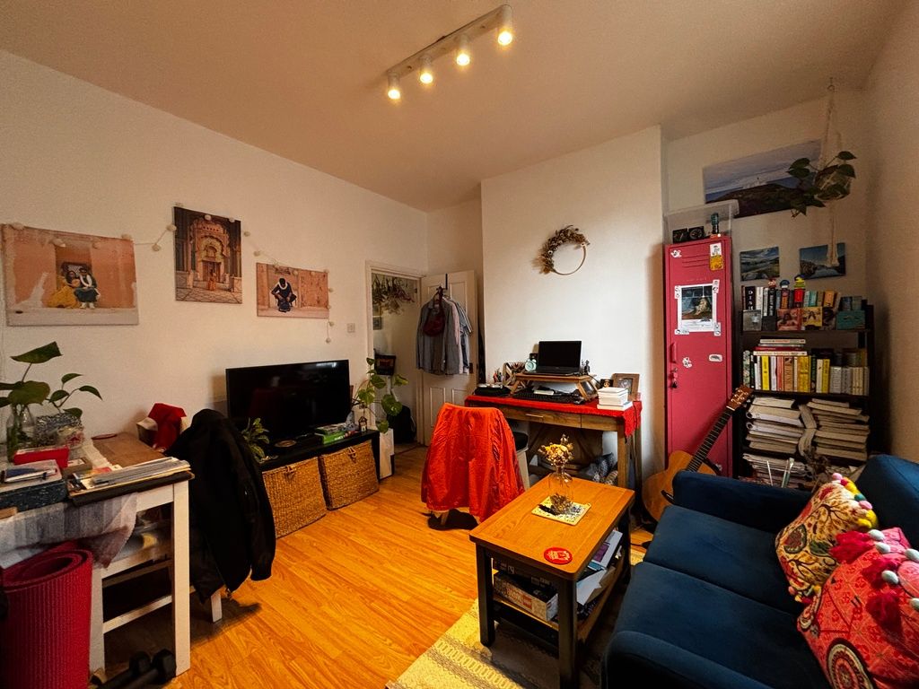 Property photo 3 of 9 Cosy And Vibrant Lounge With Warm Wooden Floors...