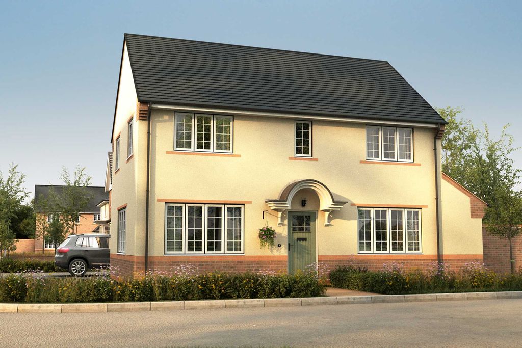 Property photo 1 of 9 A Light Yellow House With A Dark Roof And Brick Trim Stands On A Paved Street