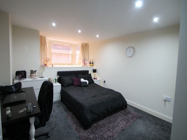Property photo 3 of 12 A Cozy Bedroom Featuring A Comfortable Double Bed,...
