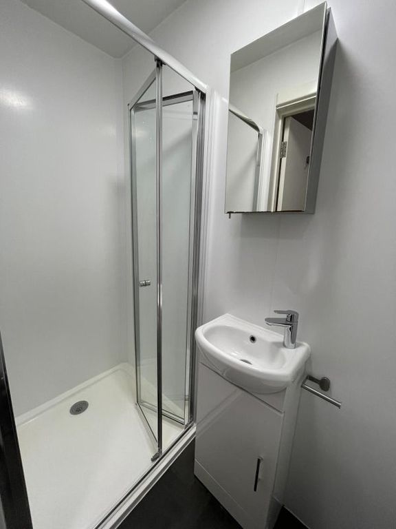 Property photo 3 of 8 Bright, Modern Bathroom With A Corner Shower Enclo...