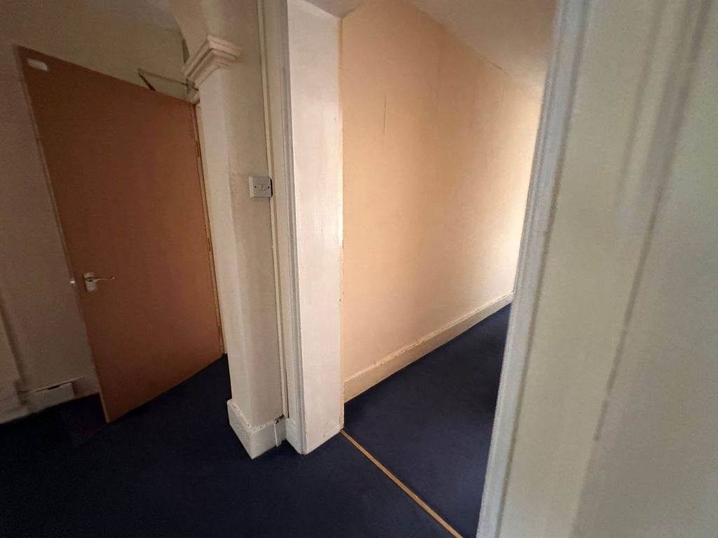 Property photo 1 of 18 A Simple Hallway With Blue Carpet Flooring And Cre...