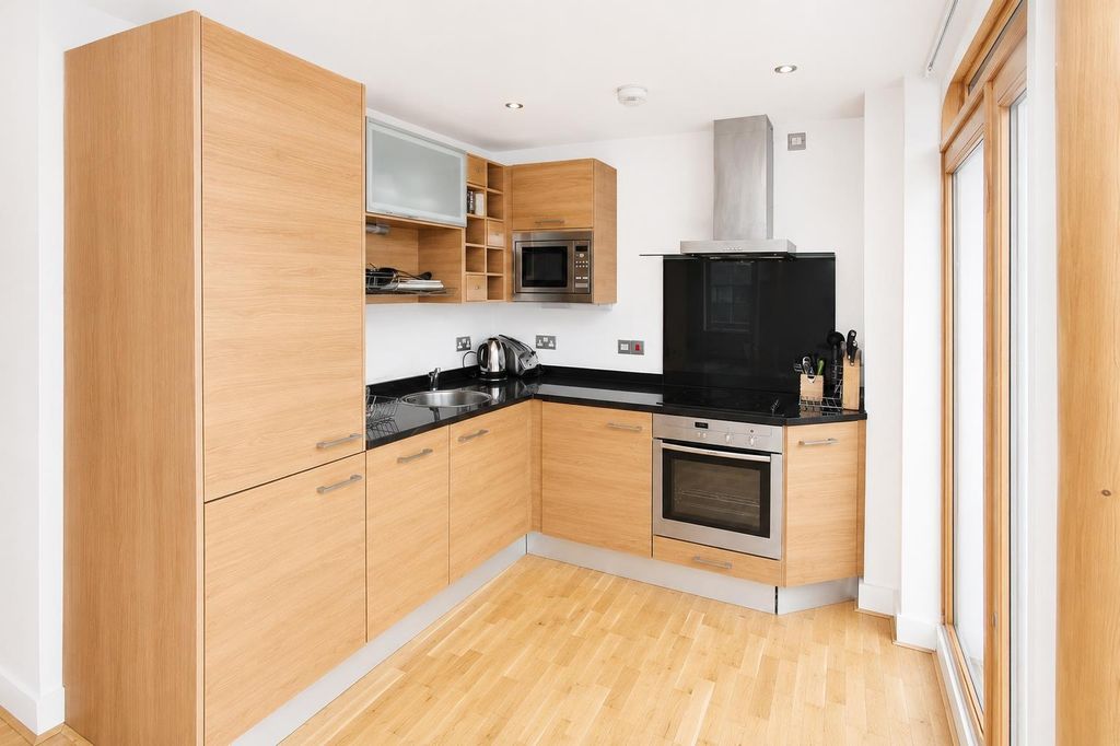 Property photo 2 of 9 Modern Fitted Kitchen With Sleek Appliances...