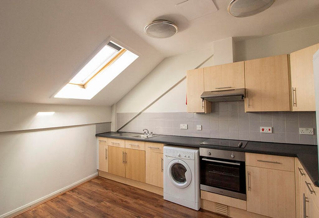 Property photo 3 of 4 This Modern Kitchen Features Ample Storage With li...