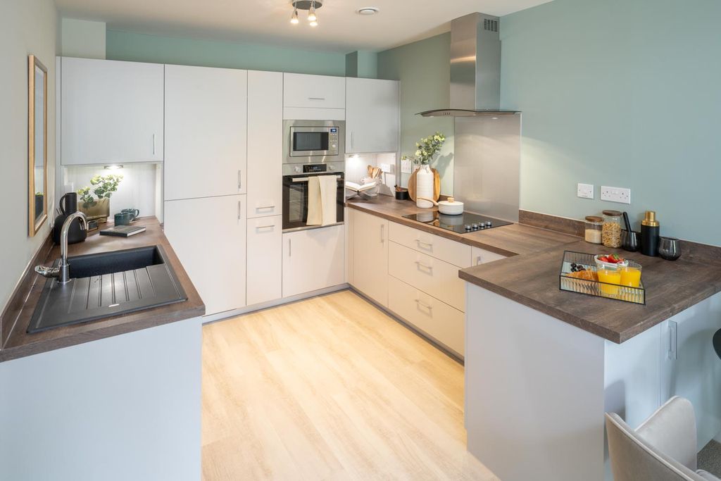 Property photo 3 of 17 Typical Kitchen