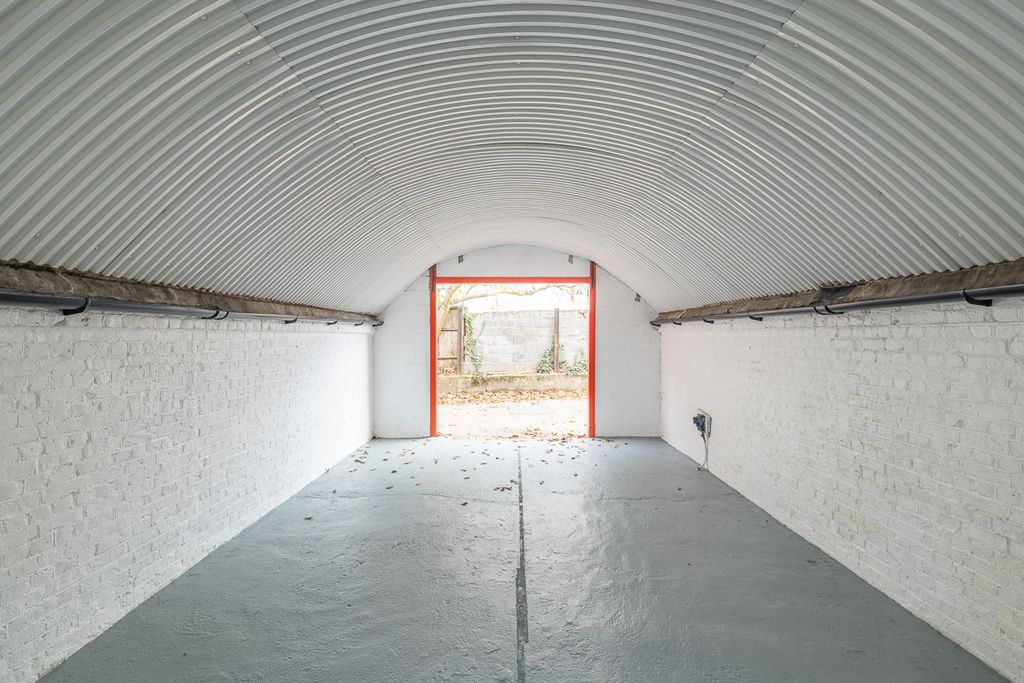 Property photo 3 of 3 An Empty Arch With White Lining, Facing The Front Electric Roller Shutter Entrance, Which Is Open.