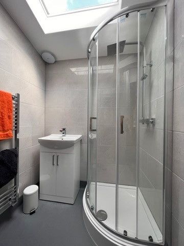 Property photo 3 of 16 Modern Tiled Bathroom With A Curved Glass Shower E...