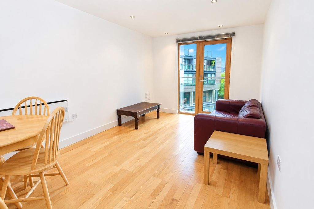 Property photo 2 of 8 Bright Living Area With Wooden Floor And Balcony...