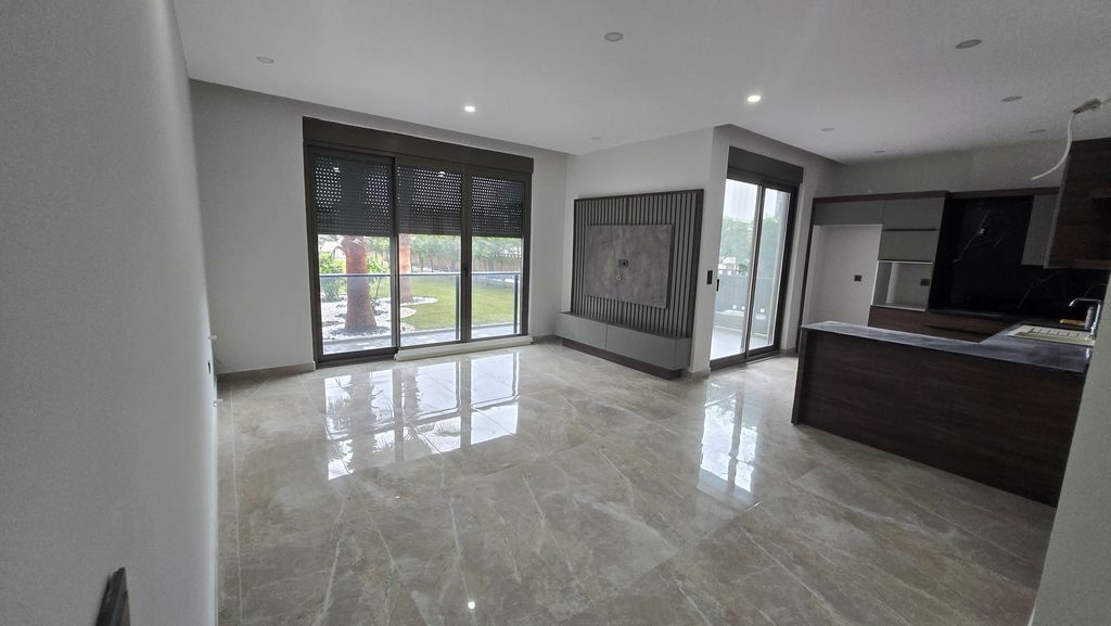 Property photo 3 of 11 Tasteful Belek Apartment In Antalya For Sale - Spacious Open-Plan Living Area
