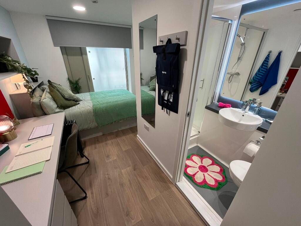 Property photo 1 of 14 Bright And Inviting Master Bedroom Featuring A Com...