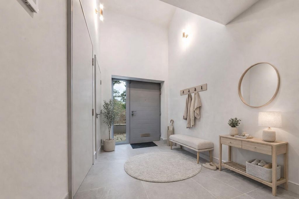 Property photo 2 of 7 Modern Minimalist Entryway With Olive Tree.Png