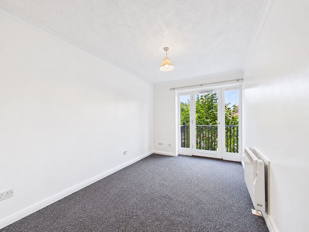 Property photo 3 of 7 Bright Minimalist Room With Balcony Doors