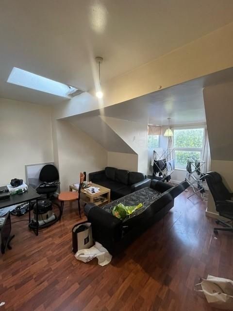 Property photo 3 of 6 Bright And Modern Living Room Featuring Ample Natu...